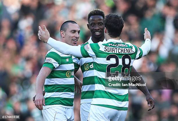 Scott Brown, Moussa Dembele and Erik Sviatchenko of Celtic celebrate at full time during the Betfred Cup Semi Final match between Rangers and Celtic...