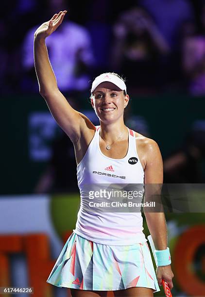 Angelique Kerber of Germany celebrates victory in her singles match against Dominika Cibulkova of Slovakia during day 1 of the BNP Paribas WTA Finals...