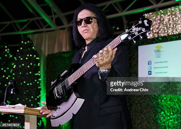 Gene Simmon auctions his guitar during the 17th Annual Yellow Brick Road Gala of Hope at Newlands Golf and Country Club on October 22, 2016 in...