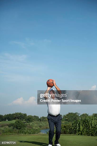 Mark O'Meara of USA plays basketball at the 17th hole during the World Celebrity Pro-Am 2016 Mission Hills China Golf Tournament on 22 October 2016,...