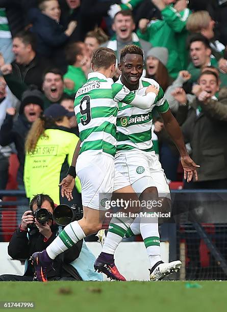 Moussa Dembele of Celtic celebrates with Leigh Griffiths of Celtic after he scores through the legs of Matt Gilks of Rangers during the Betfred Cup...