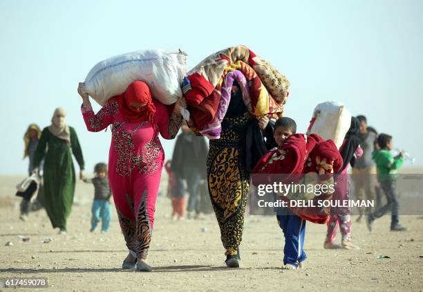 Iraqi refugees who fled Mosul, the last major Iraqi city under the control of the Islamic State group, due the Iraqi government forces offensive to...