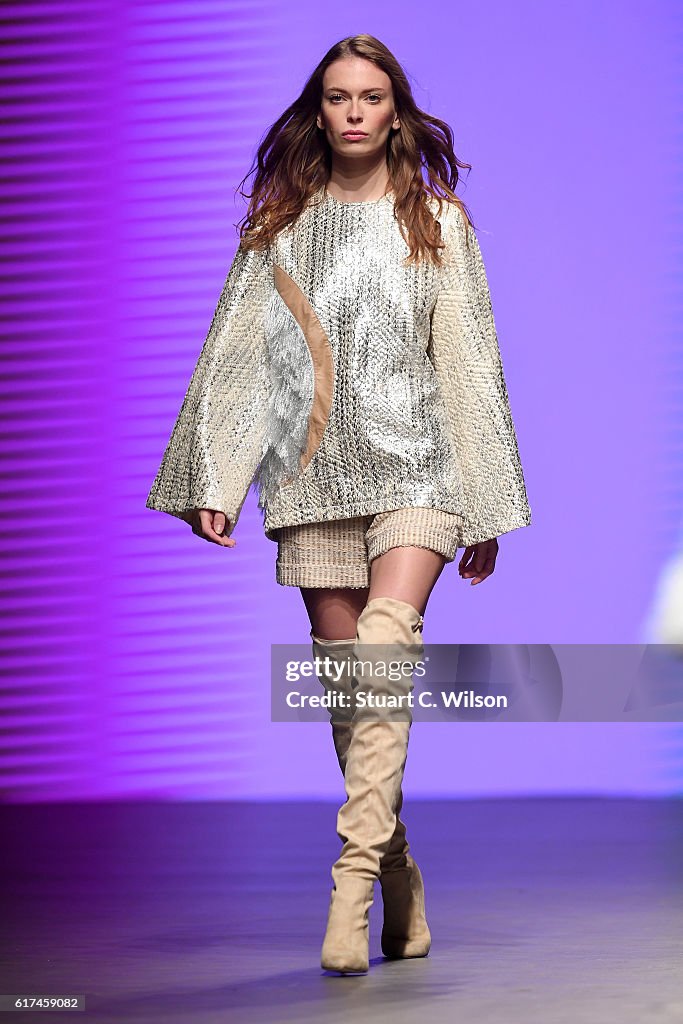 A model walks the runway during the Madiyah Al Sharqi show at Fashion ...