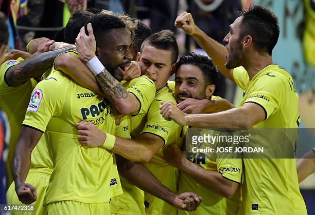 Villarreal's Congolese forward Cedric Bakambu celebrates a goal with teammates during the Spanish league football match between Villarreal CF and UD...