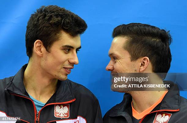Silver medalists, Poland's Jakub Dyjas and Daniel Gorak pose on the podium in "Tuskecsarnok" sports hall of Budapest on October 23, 2016 during the...