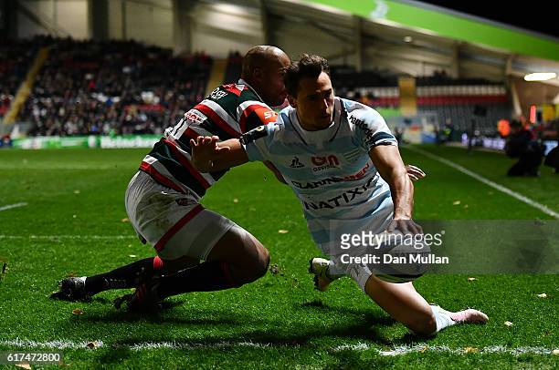 Juan Imhoff of Racing 92 scores his side's second try past JP Pietersen of Leicester Tigers during the European Rugby Champions Cup match between...