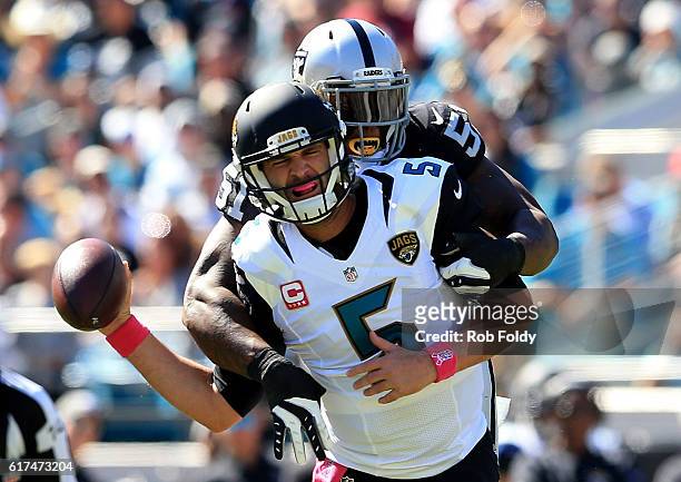 Blake Bortles of the Jacksonville Jaguars is tackled by Bruce Irvin of the Oakland Raiders during the game at EverBank Field on October 23, 2016 in...