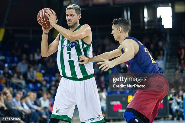 The Real Betis player Bostjan Nachbar from Slovenia in action defensed by The FC Barcelona player Marcus Eriksson from Sweden during the 2016/2017...