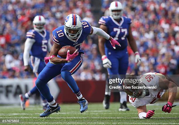 Robert Woods of the Buffalo Bills carries the ball during NFL game action as Nick Bellore of the San Francisco 49ers attempts a tackle at New Era...