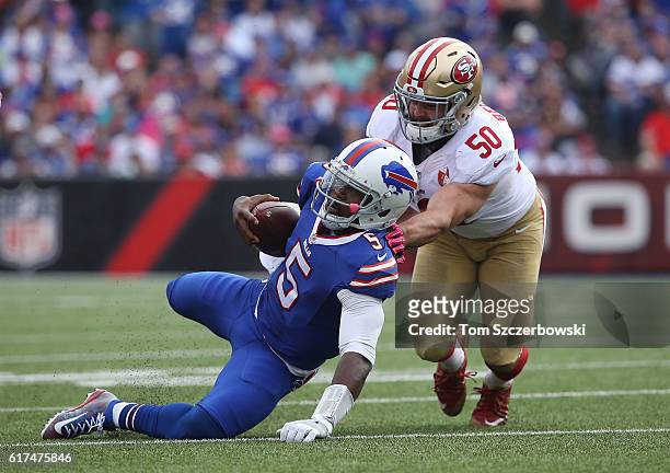 Tyrod Taylor of the Buffalo Bills is tackled by Nick Bellore of the San Francisco 49ers during NFL game action at New Era Field on October 16, 2016...