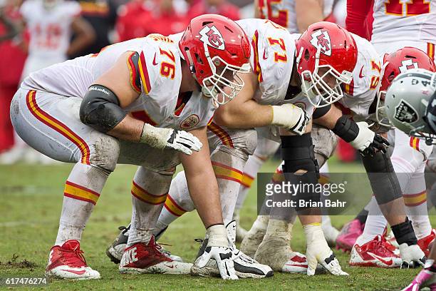 Right guard Laurent Duvernay-Tardif abd right tackle Mitchell Schwartz of the Kansas City Chiefs prepare for a snap against the Oakland Raiders in...