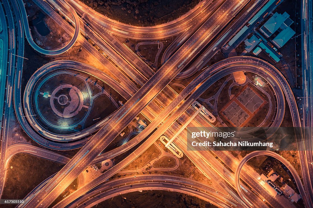 Top view of an infinity road, highway traffic and city