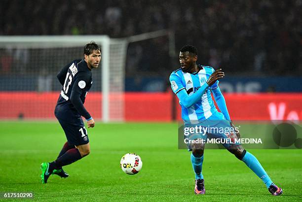 Paris Saint-Germain's Brazilian defender Maxwell vies with Olympique de Marseille's French defender Rod Fanni during the French L1 football match...