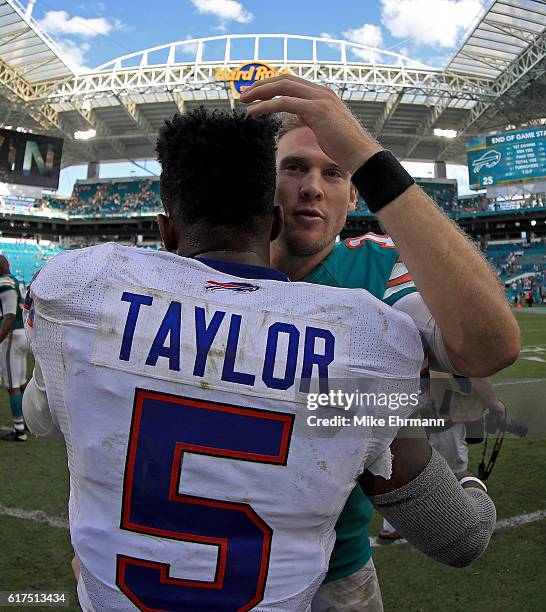Ryan Tannehill of the Miami Dolphins and Tyrod Taylor of the Buffalo Bills shake hands during a game at Hard Rock Stadium on October 23, 2016 in...