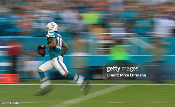 Kenny Stills of the Miami Dolphins rushes for a touchdown during a game against the Buffalo Bills at Hard Rock Stadium on October 23, 2016 in Miami...