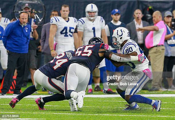 Chester Rogers of the Indianapolis Colts attempts to get around Benardrick McKinney of the Houston Texans and Johnathan Joseph at NRG Stadium on...