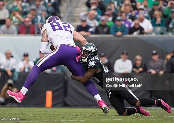 Jaylen Watkins of the Philadelphia Eagles tackles Kyle Rudolph of the Minnesota Vikings in the second quarter at Lincoln Financial Field on October...