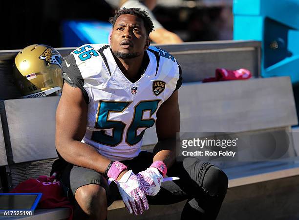 Dante Fowler of the Jacksonville Jaguars looks on from the bench during the fourth quarter of the game against the Oakland Raiders at EverBank Field...