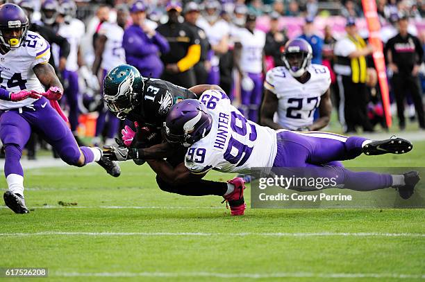 Wide receiver Josh Huff of the Philadelphia Eagles is tackled by defensive end Danielle Hunter of the Minnesota Vikings in the fourth quarter at...