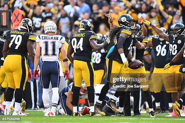 Jarvis Jones of the Pittsburgh Steelers reacts after recovering a fumble in the first quarter during the game against the New England Patriots at...