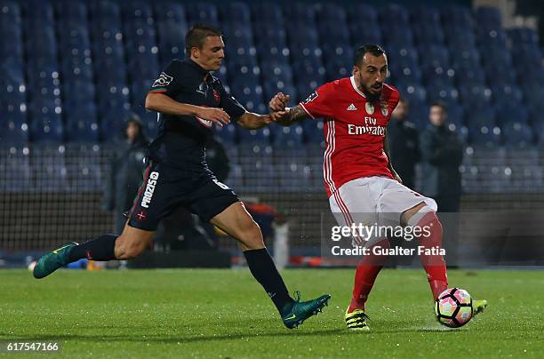 Benfica's forward from Greece Kostas Mitroglou with Belenenses's midfielder Joao Palhinha from Portugal in action during the Primeira Liga match...