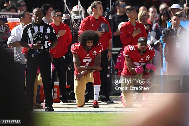 Eric Reid and Colin Kaepernick of the San Francisco 49ers kneel in protest during the national anthem prior to their NFL game against the Tampa Bay...