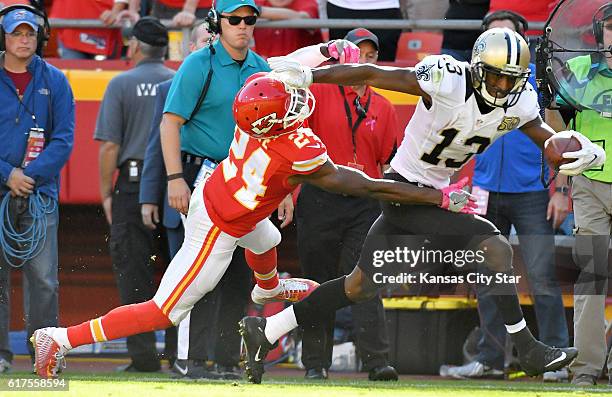 Kansas City Chiefs cornerback D.J. White pushes New Orleans Saints wide receiver Michael Thomas out of bounds at the eighth yard line on a first down...