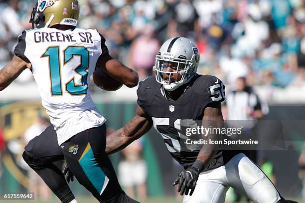Oakland Raiders Linebacker Daren Bates eyes Jacksonville Jaguars Wide Receiver Rashad Greene during the NFL game between the Oakland Raiders and the...