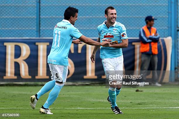 Horacio Calcaterra of Sporting Cristal celebrates with teammates after scoring the fourth goal of his team during a match between Sporting Cristal...