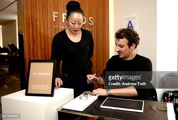 Annex Song and Nicolas Ouchenir attend Artisan Day hosted by Barneys New York on October 23, 2016 in New York City.