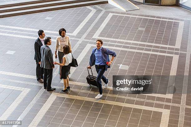 People Rushing Into Building Man Walking Past Building Photos and Premium High Res Pictures - Getty ...