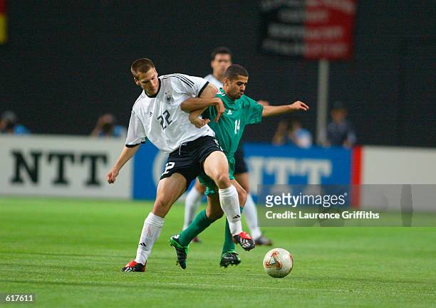 Torsten Frings of Germany and Abdulaziz Khathran of Saudi Arabia during the Germany v Saudi Arabia, Group E, World Cup Group Stage match played at...