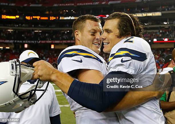 Philip Rivers of the San Diego Chargers celebrates with Josh Lambo after Lambo's game-winning field goal in a 33-30 overtime win over the Atlanta...