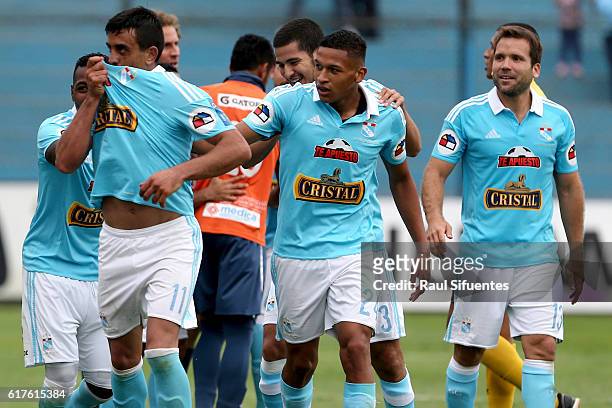 Diego Ifran of Sporting Cristal celebrates with teammates after scoring the fifth goal of his team during a match between Sporting Cristal and Cesar...