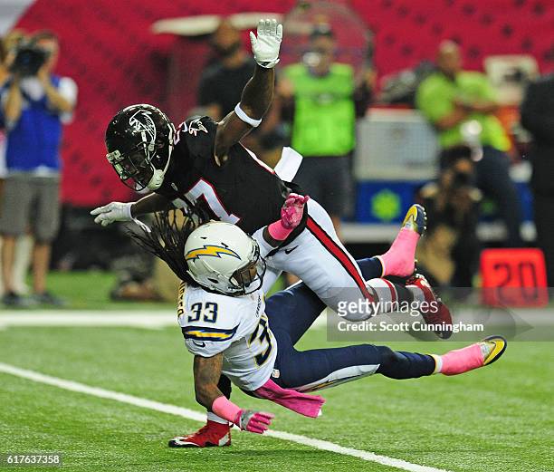 Robenson Therezie of the Atlanta Falcons interferes with Dexter McCluster of the San Diego Chargers during a punt at the Georgia Dome on October 23,...