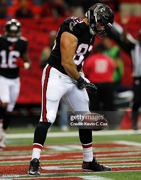 Jacob Tamme of the Atlanta Falcons celebrates pulling in a reception for a touchdown against the San Diego Chargers at Georgia Dome on October 23,...