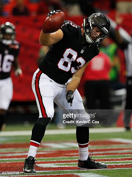 Jacob Tamme of the Atlanta Falcons celebrates pulling in a reception for a touchdown against the San Diego Chargers at Georgia Dome on October 23,...