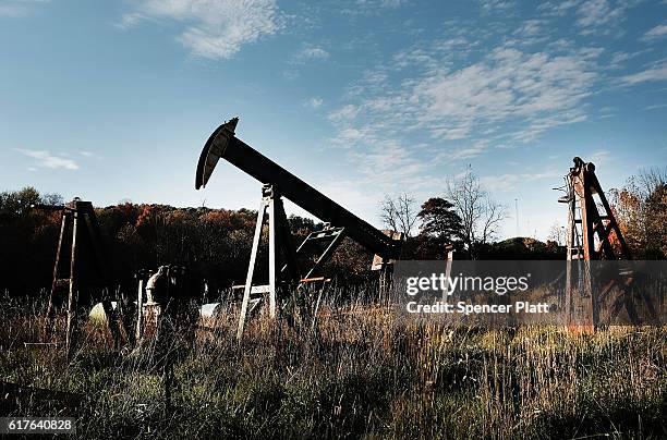 Pumps used in the oil business sit in a yard on October 23, 2016 outside of Mount Vernon, Ohio. Ohio has become one of the key battleground states in...