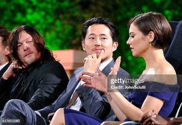 Actors Norman Reedus, Steven Yeun and Lauren Cohan speak onstage during AMC presents "Talking Dead Live" for the premiere of "The Walking Dead" at...
