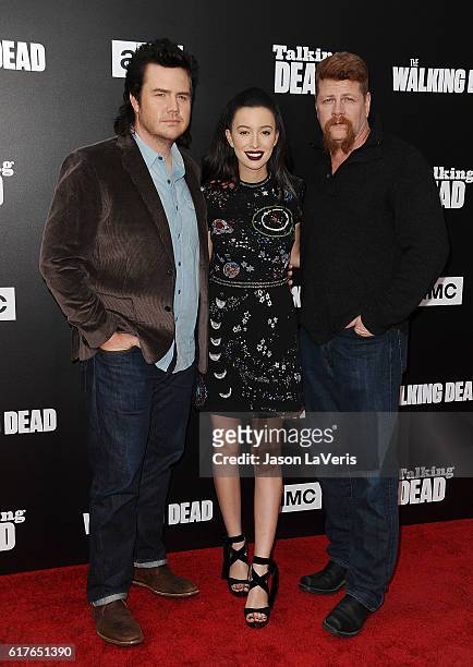 Josh McDermitt, Christian Serratos and Michael Cudlitz attend the live, 90-minute special edition of "Talking Dead" at Hollywood Forever on October...