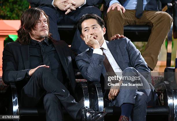 Actors Andrew Lincoln, Norman Reedus and Steven Yeun speak onstage during AMC presents "Talking Dead Live" for the premiere of "The Walking Dead" at...