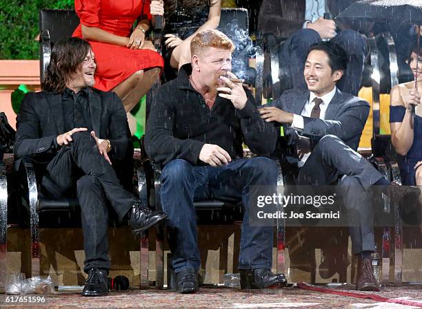 Actors Norman Reedus, Michael Cudlitz and Steven Yeun speak onstage during AMC presents "Talking Dead Live" for the premiere of "The Walking Dead" at...