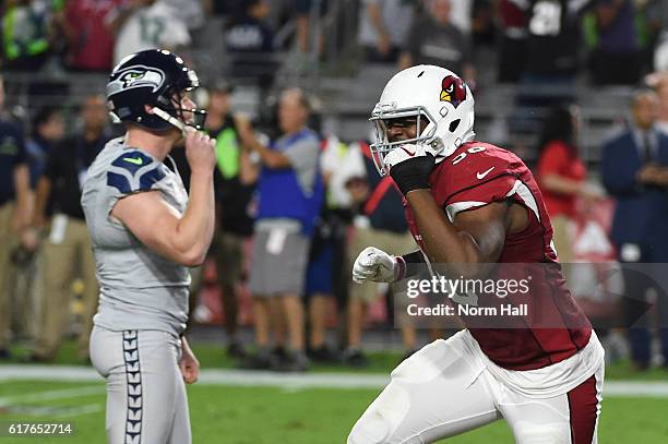 Linebacker Kareem Martin of the Arizona Cardinals and Jon Ryan of the Seattle Seahawks react after a missed field goal attempt during overtime of the...