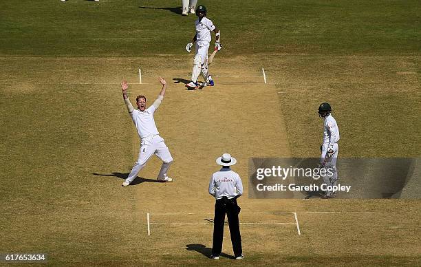 Ben Stokes of England celebrates taking the final wicket of Shafiul Islam of Bangladesh to win the first Test between Bangladesh and England at Zohur...