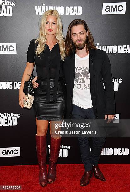 Model Jennifer Akerman and actor Tom Payne attend the live, 90-minute special edition of "Talking Dead" at Hollywood Forever on October 23, 2016 in...