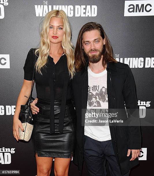 Model Jennifer Akerman and actor Tom Payne attend the live, 90-minute special edition of "Talking Dead" at Hollywood Forever on October 23, 2016 in...