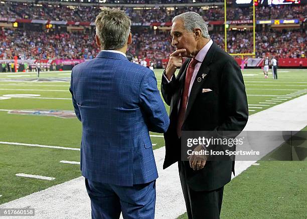 Atlanta Falcons owner Arthur Blank speaks with general manager Thomas Dimitroff on the sidelines in the San Diego Chargers 33-30 victory in overtime...