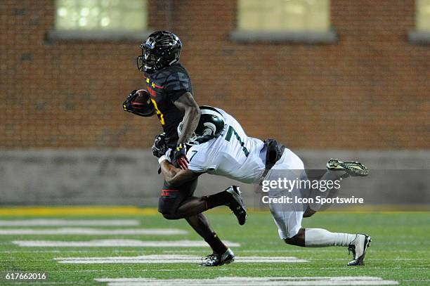 Maryland Terrapins wide receiver Teldrick Morgan catches a pass in the first quarter and is brought down by Michigan State Spartans defensive back...