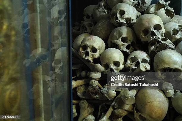 Remains of victims of pol pot regime at killing caves of Phnom Sampeau mountain. There were 343 killing fields, 167 concentration camps and 19440...