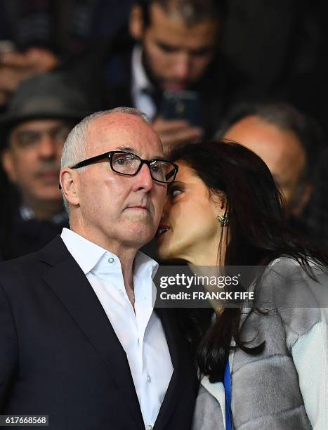 Olympique de Marseille's new owner Frank McCourt listens to his wife Monica during the French L1 football match between Paris Saint-Germain and...